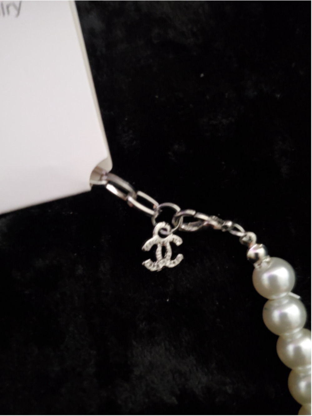 White faux pearls with silver-tone centerpiece. - Picture 2 of 5